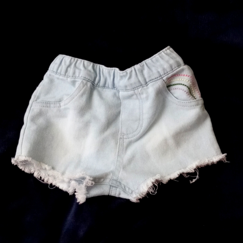 Jean fringe shorts with rainbow design in pocket